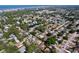 A wide aerial perspective of the community with lush greenery and the interspersion of neighborhood lakes at 13725 Oak Forest N Blvd, Seminole, FL 33776