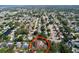 An aerial view of the neighborhood showcases the property's location and the surrounding landscape at 13725 Oak Forest N Blvd, Seminole, FL 33776