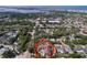 Aerial view of the property and neighborhood, showcasing the surrounding community with views of the bay at 13725 Oak Forest N Blvd, Seminole, FL 33776