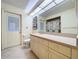 Bathroom with vanity, tile flooring, and adjacent water closet at 13725 Oak Forest N Blvd, Seminole, FL 33776
