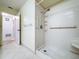 Shower room with tile flooring and accessible bars at 13725 Oak Forest N Blvd, Seminole, FL 33776