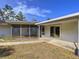 Back of home and exterior walkway showcasing the screened porch at 13725 Oak Forest N Blvd, Seminole, FL 33776