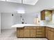Bright kitchen with white countertops and breakfast bar at 13725 Oak Forest N Blvd, Seminole, FL 33776