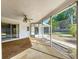 Spacious screened porch with ceiling fan overlooking the backyard at 13725 Oak Forest N Blvd, Seminole, FL 33776