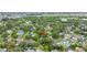 Residential homes from an aerial view, highlighting the neighborhood and nearby trees and lake at 13898 Egret Ln, Clearwater, FL 33762