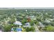 Residential homes from an aerial view, highlighting the neighborhood and nearby trees and lake at 13898 Egret Ln, Clearwater, FL 33762