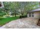 Paver patio overlooks lush green lawn and tranquil lake views at 13898 Egret Ln, Clearwater, FL 33762