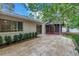 Paver patio overlooking manicured landscaping, seamlessly blending indoor and outdoor living spaces at 13898 Egret Ln, Clearwater, FL 33762