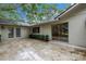 Inviting outdoor space with a paved patio, perfect for enjoying the serene backyard views at 13898 Egret Ln, Clearwater, FL 33762
