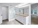 Bright bathroom featuring a large glass enclosed shower, and granite vanity at 13898 Egret Ln, Clearwater, FL 33762