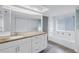 Updated bathroom showcasing the granite countertop vanity, and soaking tub at 13898 Egret Ln, Clearwater, FL 33762