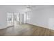 This bedroom has a ceiling fan and features access to a patio and another room at 13898 Egret Ln, Clearwater, FL 33762