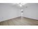 Spacious bedroom with wood floors, ceiling fan, and ample natural light at 13898 Egret Ln, Clearwater, FL 33762