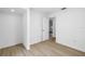 Bright bedroom features luxury vinyl flooring and a neutral color scheme at 13898 Egret Ln, Clearwater, FL 33762