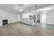 Open floor plan with modern kitchen and bright living area, perfect for entertaining at 13898 Egret Ln, Clearwater, FL 33762