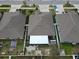 Aerial view of a property showcasing a large yard with a screened enclosure at 14015 Arbor Pines Dr, Riverview, FL 33579