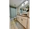 Bathroom featuring vanity with granite countertop and white cabinets at 14015 Arbor Pines Dr, Riverview, FL 33579