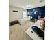 Bright bedroom decorated with a dark blue accent wall and toys at 14015 Arbor Pines Dr, Riverview, FL 33579