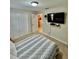 Cozy bedroom with double door closet, carpet and TV at 14015 Arbor Pines Dr, Riverview, FL 33579