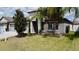 Beautiful home showcasing elegant landscaping and a well-kept lawn at 14015 Arbor Pines Dr, Riverview, FL 33579