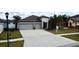 Inviting home boasting a large driveway and manicured lawn at 14015 Arbor Pines Dr, Riverview, FL 33579