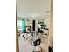 Home gym with exercise equipment, a desk, and a computer at 14015 Arbor Pines Dr, Riverview, FL 33579