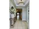 Inviting hallway with elegant lighting and an open view of the home at 14015 Arbor Pines Dr, Riverview, FL 33579