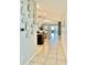 Bright hallway featuring modern decor and an open layout to the living spaces at 14015 Arbor Pines Dr, Riverview, FL 33579