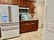 Features granite countertops, wooden cabinets, and stainless steel appliances at 14015 Arbor Pines Dr, Riverview, FL 33579