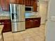 This kitchen boasts stainless steel appliances, granite countertops, and tiled floors, creating a modern and inviting space at 14015 Arbor Pines Dr, Riverview, FL 33579