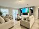 Inviting living room featuring lots of natural light, cozy seating, and a fireplace at 14015 Arbor Pines Dr, Riverview, FL 33579