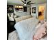 A cozy bedroom featuring an entertainment center and an ensuite bathroom at 14015 Arbor Pines Dr, Riverview, FL 33579