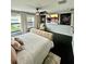 Large main bedroom with luxury bed, multiple windows, and modern decor at 14015 Arbor Pines Dr, Riverview, FL 33579