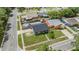 Aerial view of a home with a fenced backyard, swimming pool and residential neighborhood at 16023 Splitlog Dr, Tampa, FL 33618