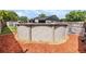 Backyard features an above ground pool, surrounded by mulch at 16023 Splitlog Dr, Tampa, FL 33618