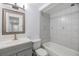 Clean bathroom featuring a vanity with sink, toilet, and a shower-tub combo at 16023 Splitlog Dr, Tampa, FL 33618