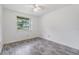 Bedroom featuring laminate flooring, natural light, and ceiling fan at 16023 Splitlog Dr, Tampa, FL 33618