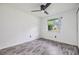 Bedroom with laminate flooring, ceiling fan, and large window at 16023 Splitlog Dr, Tampa, FL 33618