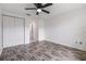 Bedroom with laminate flooring and a double door closet at 16023 Splitlog Dr, Tampa, FL 33618