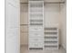 Organized walk-in closet with custom shelving, drawers, and ample storage space at 16023 Splitlog Dr, Tampa, FL 33618