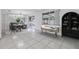 Bright dining room featuring tile floors, sliding door access, and a cozy seating area at 16023 Splitlog Dr, Tampa, FL 33618