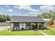 Beautiful single-story home with well-manicured lawn and lovely landscaping at 16023 Splitlog Dr, Tampa, FL 33618
