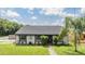 Charming single-story home featuring manicured landscaping and a welcoming entrance at 16023 Splitlog Dr, Tampa, FL 33618