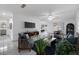 Inviting living room with ample natural light, neutral walls, tile floor, and modern furnishings at 16023 Splitlog Dr, Tampa, FL 33618