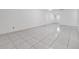Spacious living room with tiled flooring and an entry door at 16023 Splitlog Dr, Tampa, FL 33618