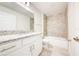Modern bathroom featuring granite counters, vanity, tiled shower, and updated fixtures at 16503 66Th E Ln, Parrish, FL 34219