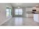 Bright dining area featuring tile floors, modern chandelier and natural light from oversized windows at 16503 66Th E Ln, Parrish, FL 34219
