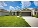 Charming single-Gathering home featuring a well-manicured lawn, and a two-car garage at 16503 66Th E Ln, Parrish, FL 34219