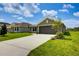 Well maintained single Gathering home with large driveway, nice lawn and tropical landscaping at 16503 66Th E Ln, Parrish, FL 34219