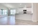 Spacious kitchen with white cabinets, stainless appliances, and peninsula island at 16503 66Th E Ln, Parrish, FL 34219